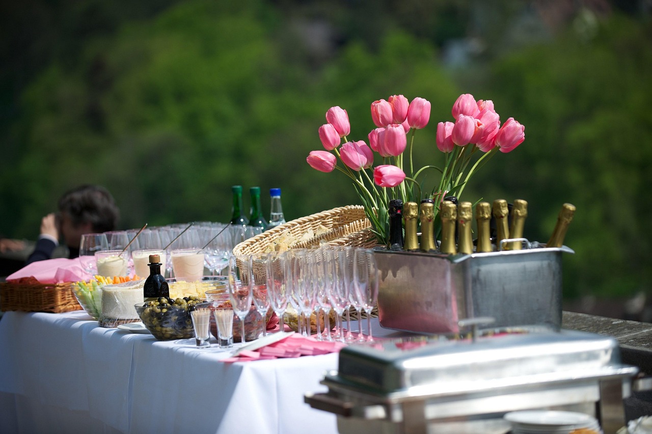 happy guests enjoying food and conversation together at an outdoor catered event